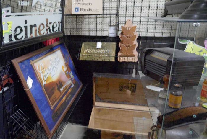 vintage beer mirrors, vintage radio, vintage brass relief art, humpback trunk