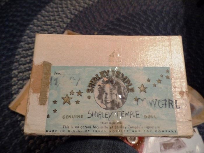 Box for Shirley Temple doll, top part is torn but can be put back together