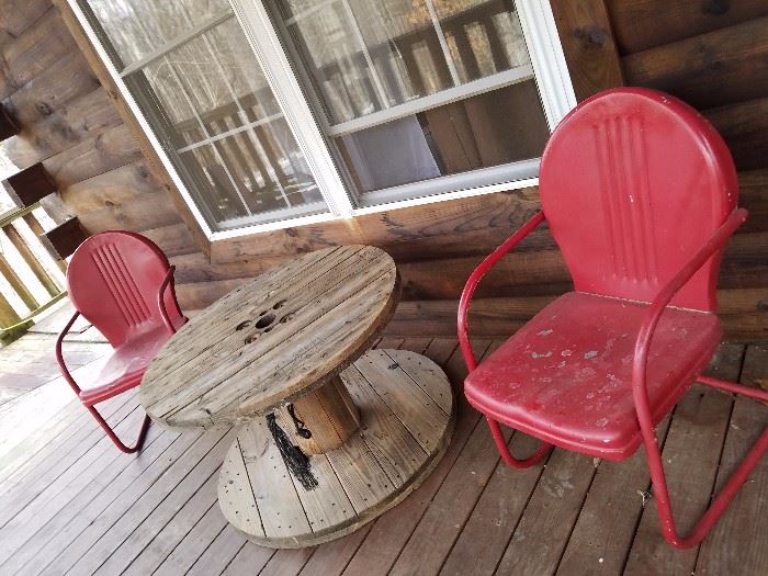 Old wire spool and porch chairs