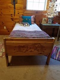 Twin beds with cowboy horses motif