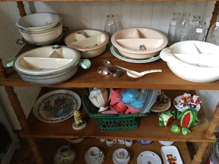Vintage baby plates, spoons and old bottles.