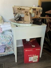 Two vintage Singer sewing machines (500A & 401A), Viking model 905 sewing machine, sewing cabinet, and sewing accessories
