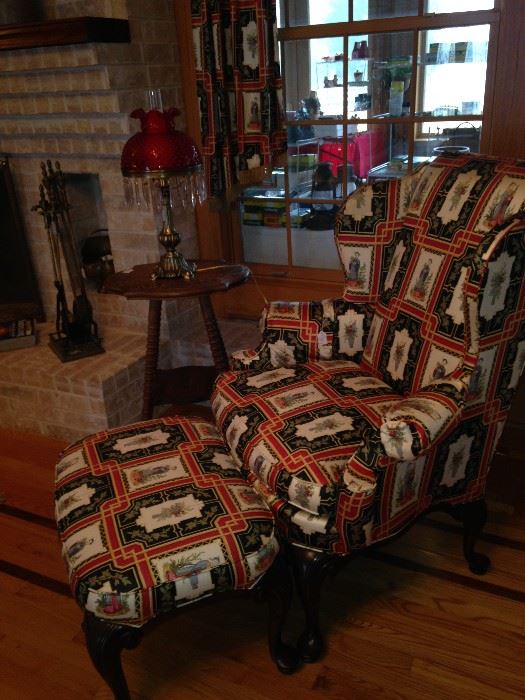 One of two Asian print wingback chairs & ottoman