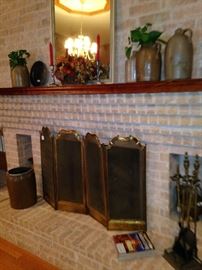 Brass fire screen, fireplace tools, mirror, and jugs