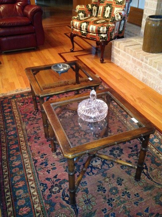 Two of three matching glass top coffee tables