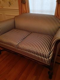 Striped antique settee has a matching rocker