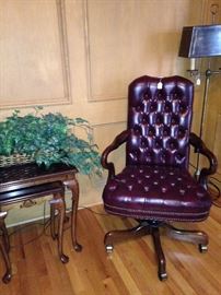 Stack tables; one of several desk chairs; floor lamp