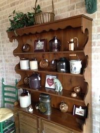 Maple hutch filled with vintage jugs