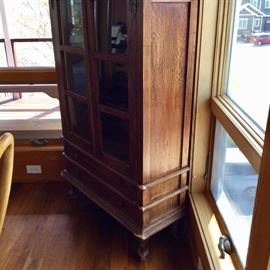 side view of antique vitrine cabinet