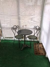CAST IRON MARBLE TOP TABLE AND TWO CHAIRS