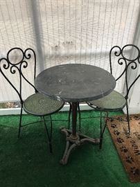 CAST IRON MARBLE TOP TABLE AND TWO CHAIRS
