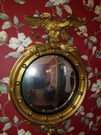 Eagle crest convex mirror on the dining room wall