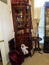Corner china cabinet in Mahogany with curved doors.