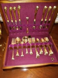 Gold tone flatware for 8