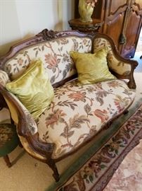 Carved frame small sofa or loveseat