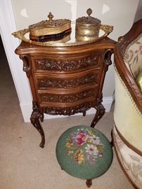 Ornately carved stand, Needlepoint foot stool, Mirrored plateau with 'jeweled' covered boxes on top.