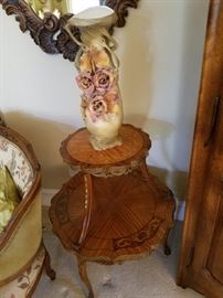 Two tier inlaid table displaying vase attributed to Royal Dux by Patsy Wassenaar.