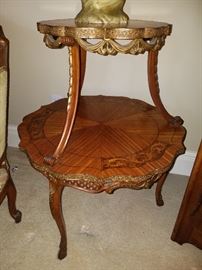 Close up of table showing inlaid patterns and embossed metal edges