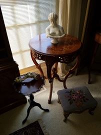 Carved and inlaid table, Small piecrust edge stand, Needlepoint foot stool.  There are a pair of the inlaid tables available.