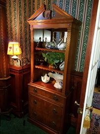 The other one, next to an iron floor lamp