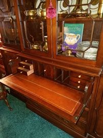 With the desk section open (closes to look like a drawer when not in use) on this great Baker Furniture Company breakfront.