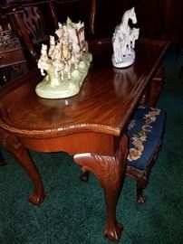 Mahogany coffee table, Porcelain equestrian groups, Upholstered foot stool