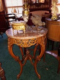 Marble top carved wood table.