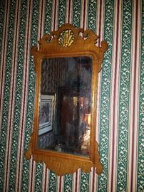 Shaped mirror.  There are several throughout the home