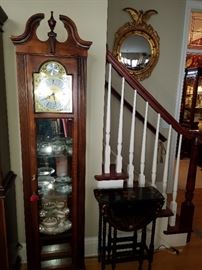 Battery operated clock/curio (lighted), next to a paint decorated gateleg table
