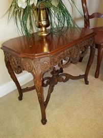 Ornately carved stand