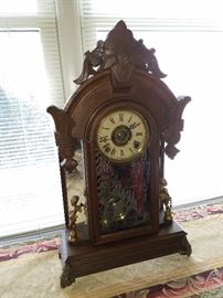 Ca. 1885 mirror-side clock (working at this time, but not guaranteed). Cannot completely read the dial (partially obscured), but was made in New York.  Believed to be by Ansonia Clock Co.
