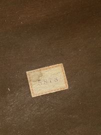 paper label at the bottom of the storage area