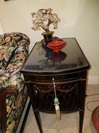 One of a pair of these stands with glass over the solid tops