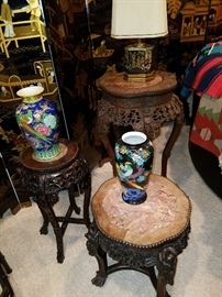 3 Assorted carved rosewood stands with marble inset tops, displaying porcelain vases, and a lamp