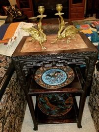 Square carved stand with marble inset top. Bottom shelf with studio pottery bowl. Top shelf with cloisonne plate