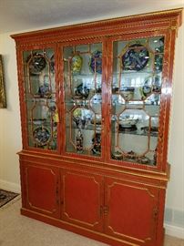 Milling Road (Baker) red lacquer breakfront displaying oriental style porcelains of recent manufacture