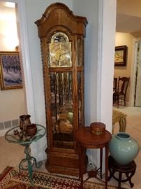 Howard Miller triple train, triple chime tall case clock with moon dial and seconds hand sub dial.  Working.  No clocks are guaranteed.  Sold as is, where is.  You move.