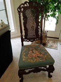 Cane back 1920's chair with needlepoint seat