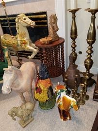 Grouping of animal figures of various sizes and styles.  A pair of floor candlesticks