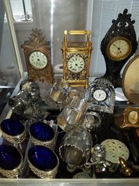 Silverplate napkin rings, Sterling and cobalt blue salt dips, French carriage clock (working, but not guaranteed) with blue accents.  The other clocks are not working