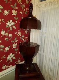 Knife box open. Top raises to reveal slots for holding knives and forks