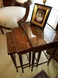 Set of 3 paint decorated nesting tables with glass tops over the painted surfaces