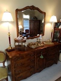 Long dresser to the Ethan Allen King bedroom suite. Includes beveled mirror.  Displaying miniature table, and dresser items