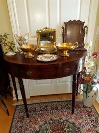 Irwin (Grand Rapids) demilune mahogany table displaying decorative items.  Gold compotes are Pickard