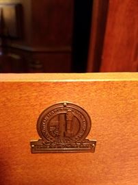 Metal tag inside the drawer "Colonial Manufacturing Company, Zeeland, Michigan" all in the circle