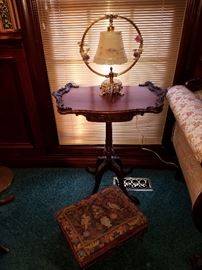 The other pedestal side table, with a needlepoint footstool, and cute lamp with porcelain flower accents.