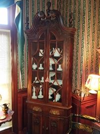Centennial Corner Cupboard, just under 8 feet tall. Beautifully carved finials, and rosettes on the broken arch.  Ca. 1900