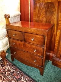 Miniature chest (note the top is below the arm of the chair)