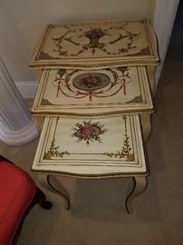Set of three paint-decorated nesting tables with glass over the painted surfaces.  Possibly the work of the Kozak Studio, Grand Rapids, but no label or identifying mark found