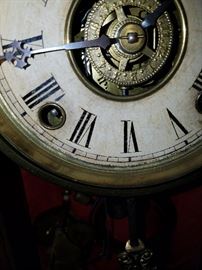 All I can read of the dial (below the chapter ring, and just above the brass bezel/frame).  Believe it to be by Ansonia Clock Co.